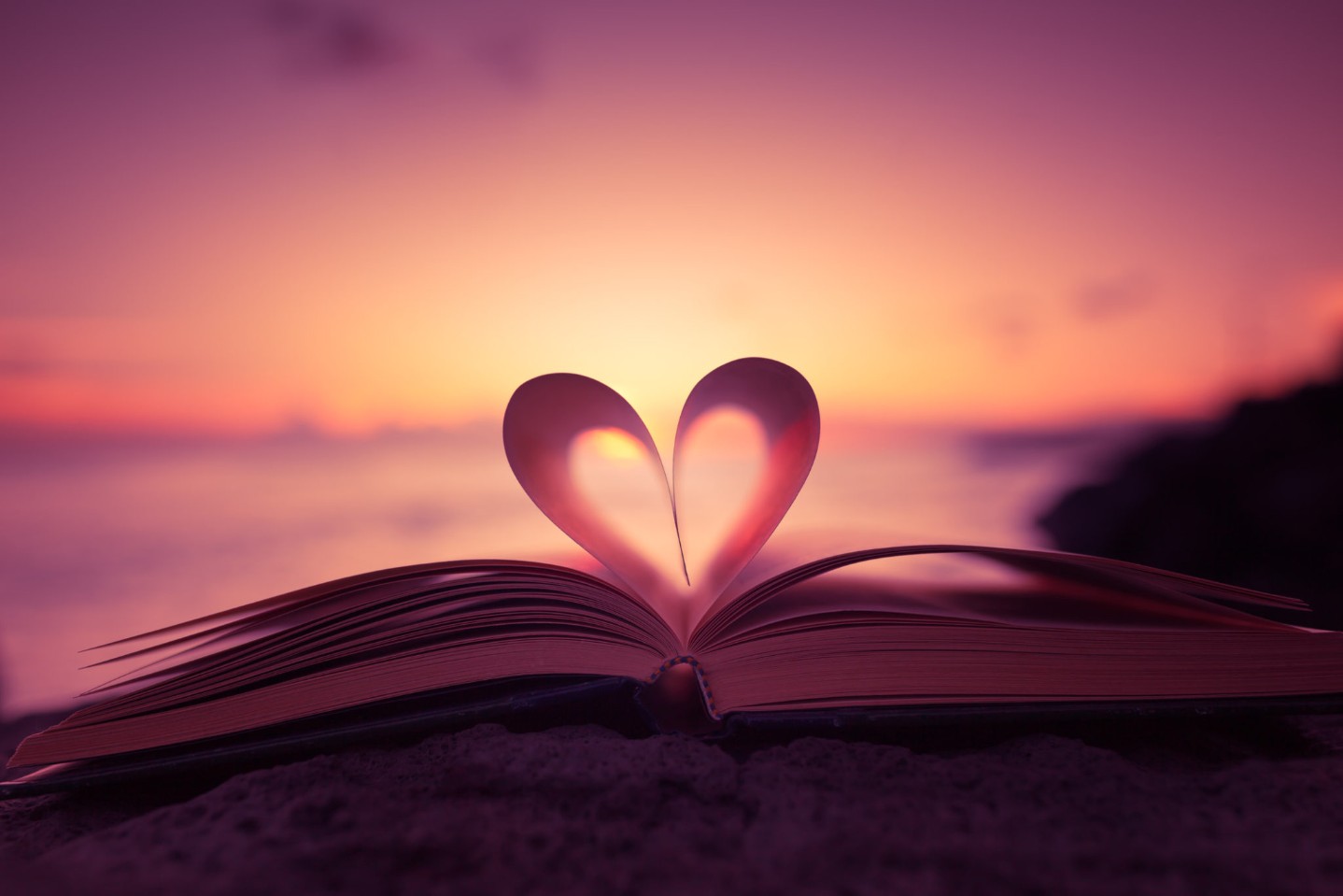 Heart shape paper book on the beach