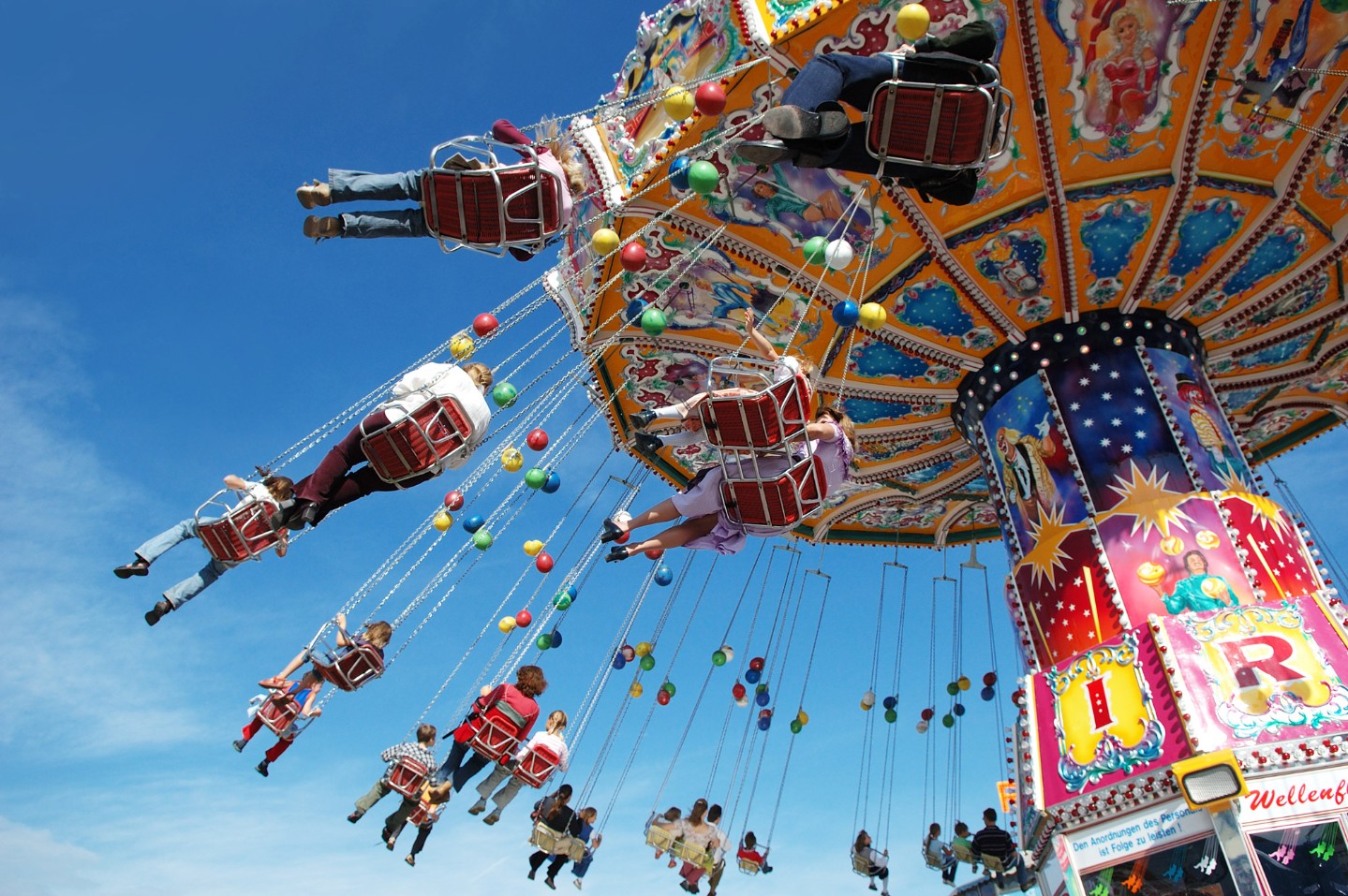 amusement park flying swings||family on a rollercoaster