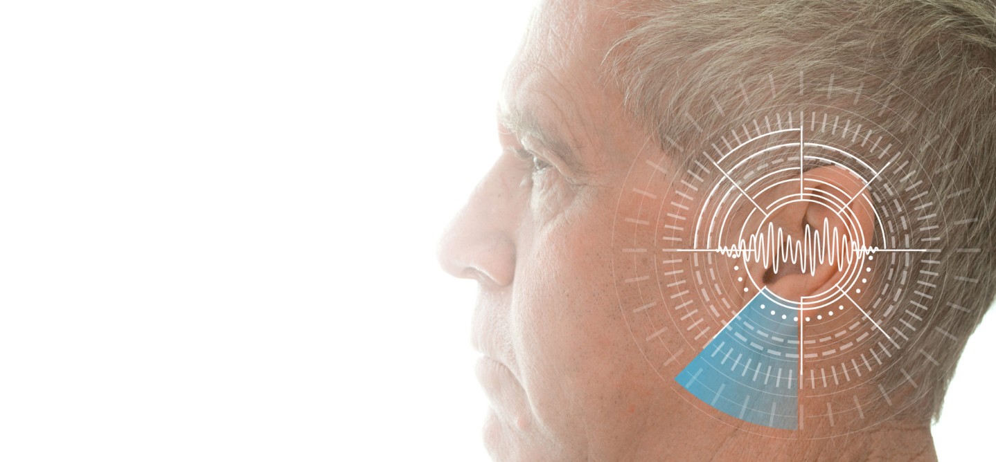 Hearing test showing ear of senior man with sound waves simulation technology