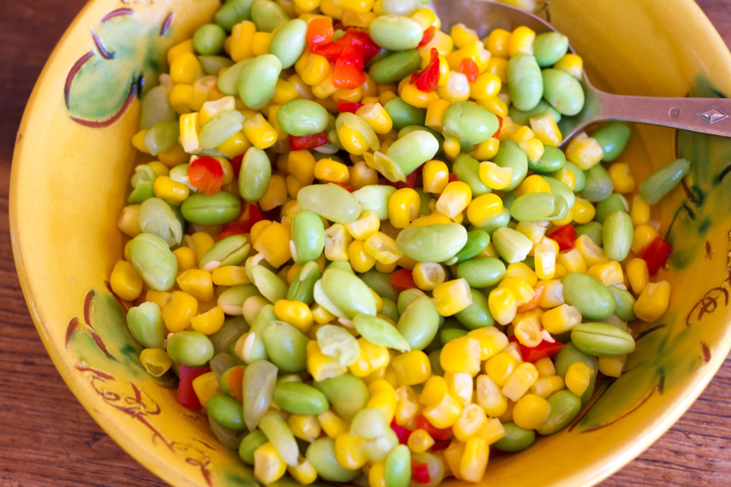 Vibrant Dish of Succotash with Spoon (Close-Up)