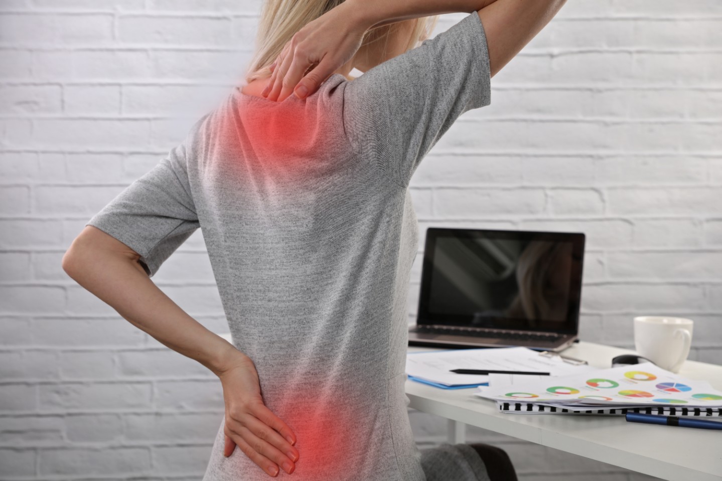 Business Woman suffering from back pain. Incorrect sitting posture problems. Pain relief , chiropractic concept.
