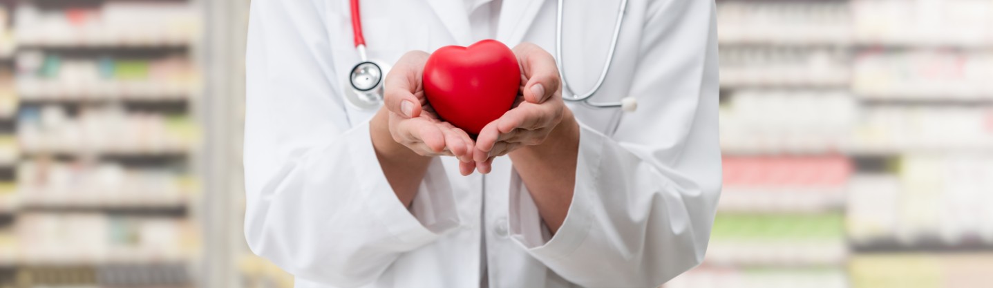 Doctor holding red heart for Cardiology Specialists