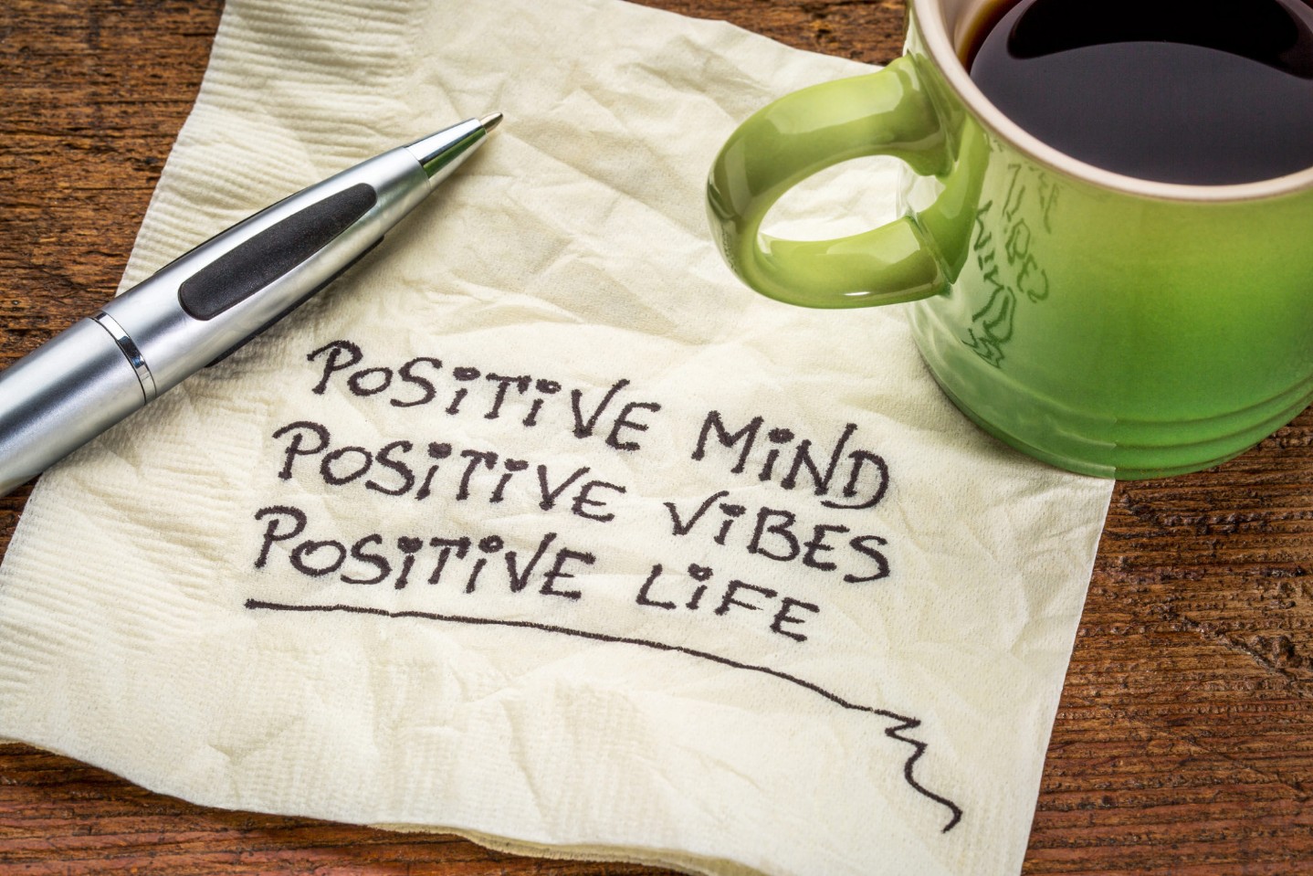 positive mind, vibes and life written on a napkin
