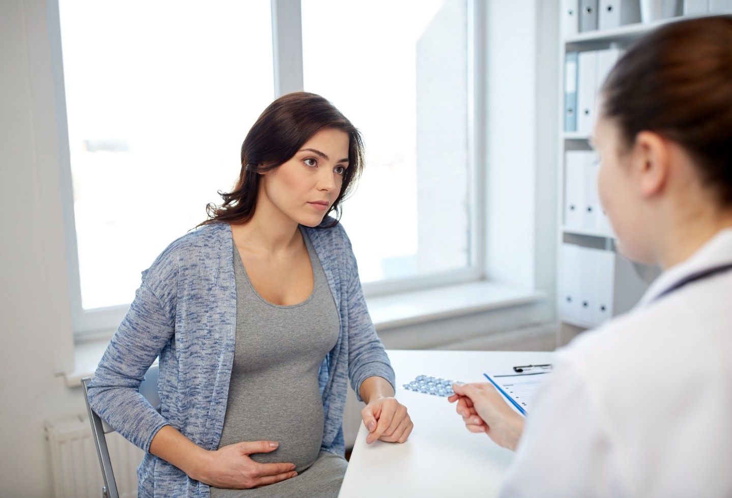 gynecologist doctor and pregnant woman at hospital