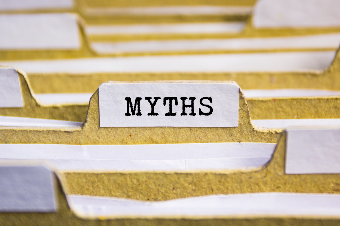File folders in a row, focused in on one labeled Myths