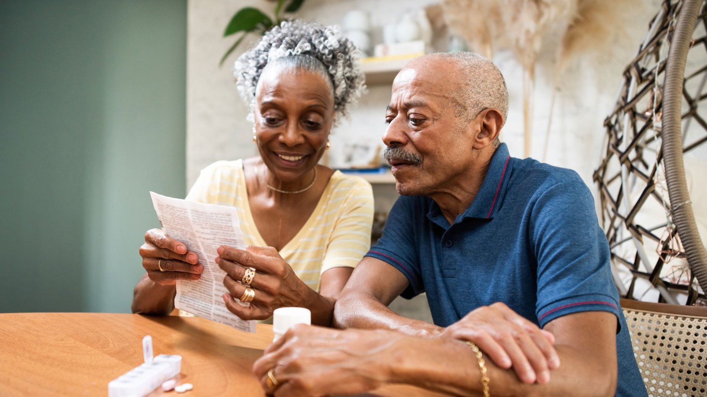 Senior couple reviewing paperwork