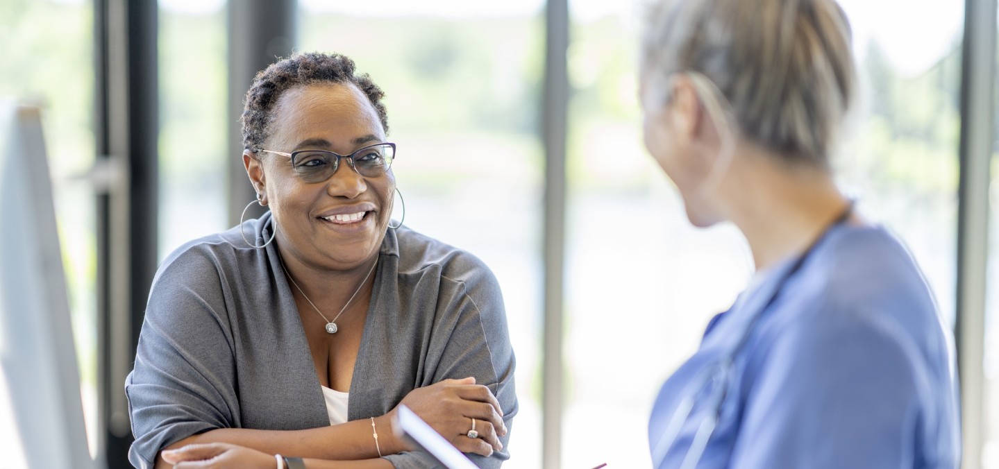 Middle aged woman talking to her doctor