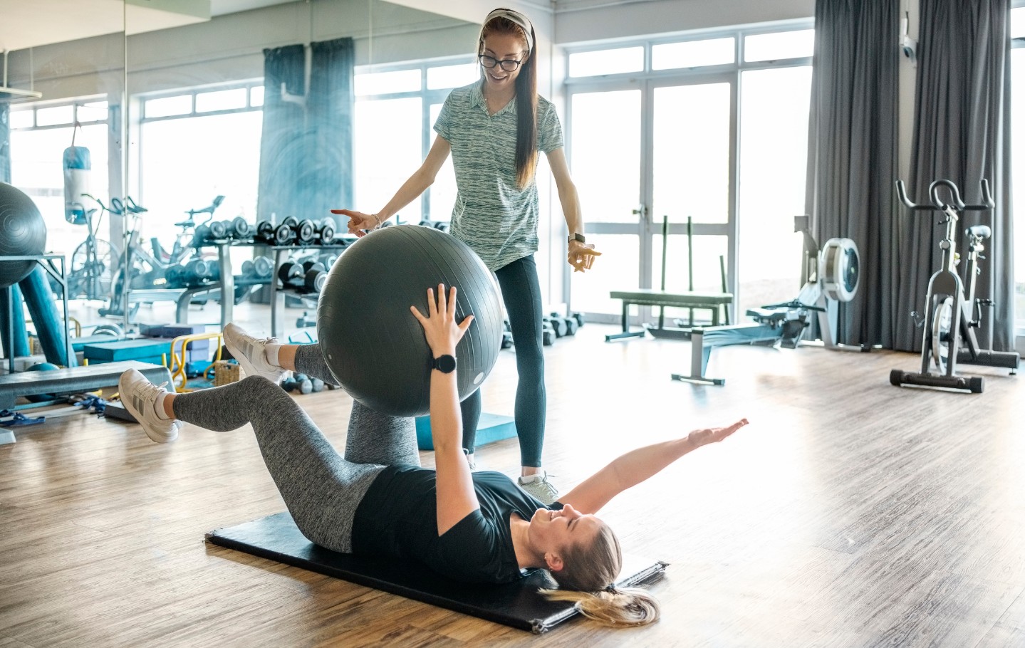 Pelvic therapist helping woman with exercises