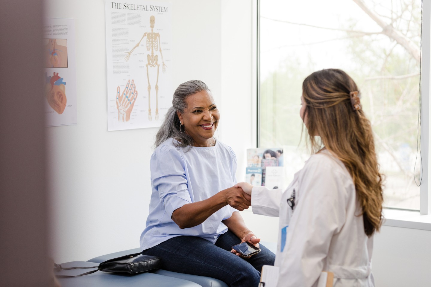 Older African American woman talking with her doctor