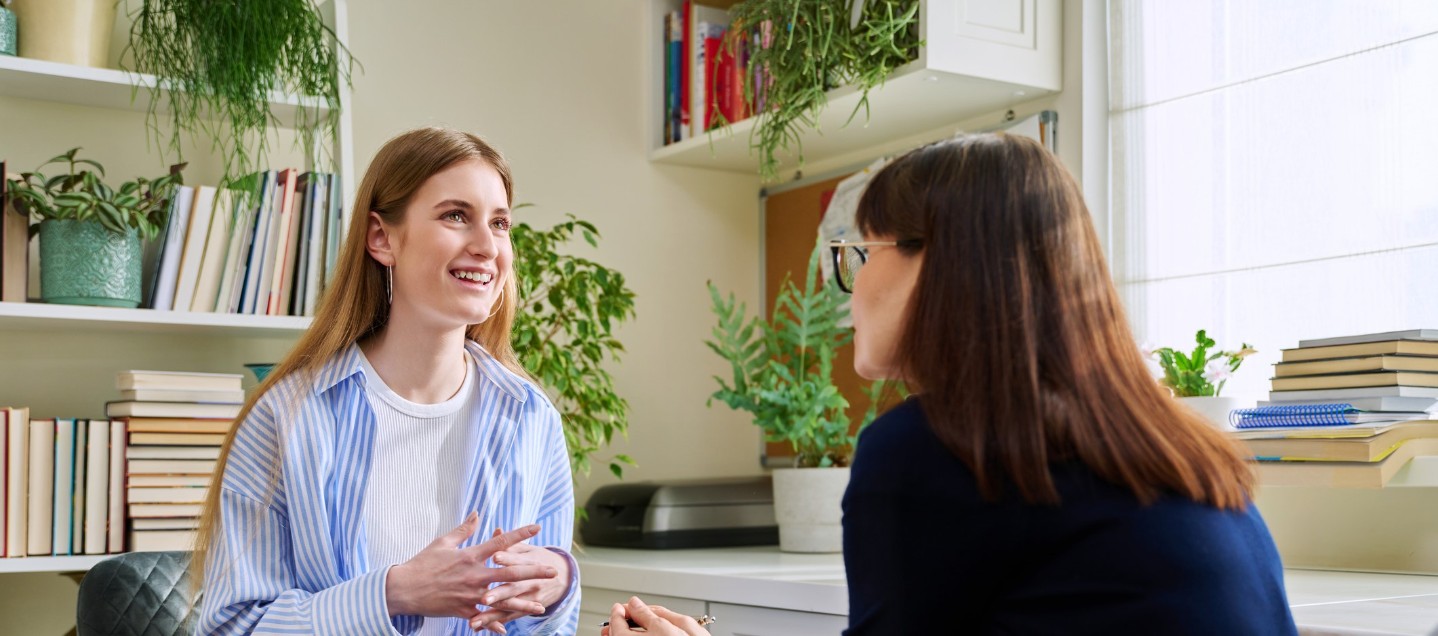 Woman checking watch looking worried that she is late